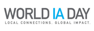 World IA Day logo. In Gray all capital letter with IA in aqua, followed by the tagline, “Local Connections, Global Impact.”